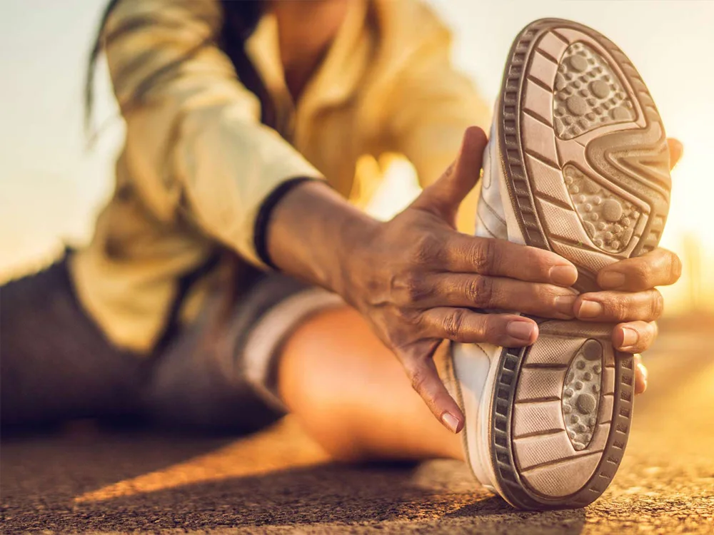 Active Person Stretching Before A Run