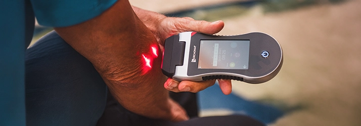 Erchonia Laser Device Being Used On A Patient's Elbow