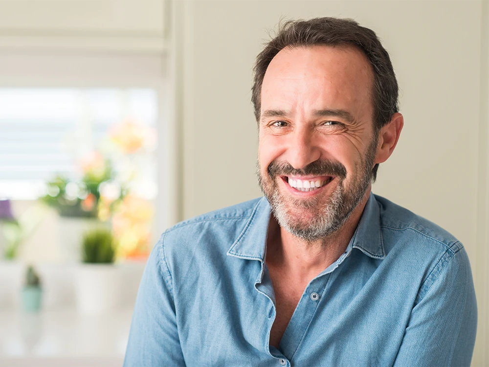 Middle Aged Man Smiling In Denim Shirt